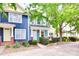 Charming multi-colored townhomes with well-maintained landscaping and inviting front porches at 461 Hurston Cir # 51, Charlotte, NC 28208