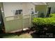 Fenced backyard with latticework, a gate, and green shrubs bordering the yard at 4938 Sunset Ridge Ct, Charlotte, NC 28269