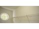 Bright closet featuring wire shelving on supports and a round window at 4938 Sunset Ridge Ct, Charlotte, NC 28269