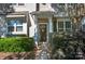 Charming front door with decorative wreath and manicured bushes at 4938 Sunset Ridge Ct, Charlotte, NC 28269