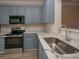Stylish kitchen features sleek countertops, modern appliances, and ample cabinet space at 4938 Sunset Ridge Ct, Charlotte, NC 28269