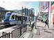 View of a light rail train at a stop in an urban location at 4938 Sunset Ridge Ct, Charlotte, NC 28269