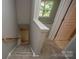 Carpeted staircase leading upstairs to the bedrooms and bathrooms at 4938 Sunset Ridge Ct, Charlotte, NC 28269