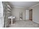 Bedroom features a desk, shelving, a neutral color scheme, and plenty of natural light at 5009 Sharon Rd # E, Charlotte, NC 28210