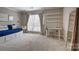 Bright bedroom with a daybed, desk, modern chair and shelving at 5009 Sharon Rd # E, Charlotte, NC 28210