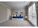 Inviting bedroom featuring a cozy daybed and bright light at 5009 Sharon Rd # E, Charlotte, NC 28210