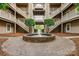 Charming courtyard featuring a central fountain and well-maintained landscaping at 5009 Sharon Rd # E, Charlotte, NC 28210