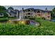 Beautiful apartment complex showcasing a large fountain and mature landscaping at 5009 Sharon Rd # E, Charlotte, NC 28210