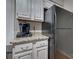 Kitchen view showcasing cabinets, granite countertops, and stainless steel refrigerator at 5009 Sharon Rd # E, Charlotte, NC 28210