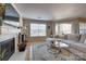 Cozy living room featuring a fireplace, hardwood floors, and modern decor at 5009 Sharon Rd # E, Charlotte, NC 28210