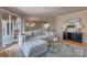 Inviting living room with sliding glass door to patio, comfortable couch, and stylish decor at 5009 Sharon Rd # E, Charlotte, NC 28210