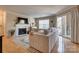 Living room with fireplace, neutral colors, and access to the balcony at 5009 Sharon Rd # E, Charlotte, NC 28210