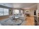 Bright living room featuring a comfortable couch and large windows at 5009 Sharon Rd # E, Charlotte, NC 28210