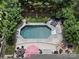 An aerial view showing a backyard featuring a pool, a fire pit, and outdoor seating areas, perfect for entertaining at 5013 Hamilton Mill Dr, Waxhaw, NC 28173