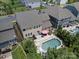 Aerial view showcasing a home with a backyard featuring a pool, patio, and well-maintained landscaping at 5013 Hamilton Mill Dr, Waxhaw, NC 28173