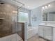 Bright bathroom featuring a glass shower and soaking tub, perfect for relaxation at 5013 Hamilton Mill Dr, Waxhaw, NC 28173