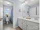 Bathroom featuring a shower-tub combination and dual sinks, providing convenience and style at 5013 Hamilton Mill Dr, Waxhaw, NC 28173
