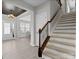 Bright entryway with hardwood floors, stairs, and a modern chandelier at 5013 Hamilton Mill Dr, Waxhaw, NC 28173