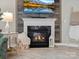 Close up of a fireplace featuring mounted TV and mantle decor at 5013 Hamilton Mill Dr, Waxhaw, NC 28173