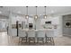Modern kitchen with a breakfast bar, stainless steel appliances, and white cabinets at 5013 Hamilton Mill Dr, Waxhaw, NC 28173