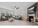 Comfortable living room featuring a fireplace, TV, and leather couch at 5013 Hamilton Mill Dr, Waxhaw, NC 28173