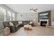 Cozy living room featuring fireplace, TV, and plenty of natural light at 5013 Hamilton Mill Dr, Waxhaw, NC 28173