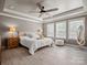 Spacious main bedroom with tray ceiling, large windows, and neutral décor at 5013 Hamilton Mill Dr, Waxhaw, NC 28173