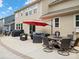Spacious outdoor patio featuring a dining set, lounge area, and grill, perfect for outdoor entertaining at 5013 Hamilton Mill Dr, Waxhaw, NC 28173