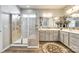This primary bathroom features dual sinks, a large walk-in shower, and ceramic tile at 5025 Kinross Ln, Indian Land, SC 29707