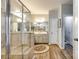 Beautiful primary bathroom showcasing a glass shower, a large vanity, and stylish flooring at 5025 Kinross Ln, Indian Land, SC 29707