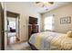This bedroom has a view of the entry hall, carpeted floor, and a large window with great light at 5025 Kinross Ln, Indian Land, SC 29707