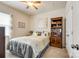 Bright bedroom with a bookcase, ceiling fan, and a large window offering plenty of natural light at 5025 Kinross Ln, Indian Land, SC 29707