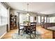 Eat-in kitchen dining area with lots of natural light features a charming table and decorative rug at 5025 Kinross Ln, Indian Land, SC 29707