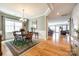 Elegant dining room with hardwood floors, large window, chandelier, and easy access to living spaces at 5025 Kinross Ln, Indian Land, SC 29707