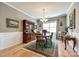Dining room with a large china cabinet, wooden table, and decorative rug at 5025 Kinross Ln, Indian Land, SC 29707