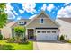 Charming single-Gathering home with a well-manicured lawn, two-car garage, and delightful landscaping at 5025 Kinross Ln, Indian Land, SC 29707