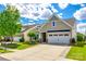 Charming home with a well-manicured lawn, inviting entrance, and a two-car garage at 5025 Kinross Ln, Indian Land, SC 29707