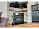 Living room fireplace featuring stone accents, modern design, and a cozy atmosphere at 5025 Kinross Ln, Indian Land, SC 29707