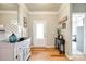 Warm and inviting foyer with hardwood floors and stylish console table at 5025 Kinross Ln, Indian Land, SC 29707