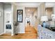 Hallway showcasing hardwood flooring, neutral paint, and modern decor at 5025 Kinross Ln, Indian Land, SC 29707