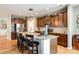 Well-equipped kitchen with granite countertops, seating island, and stainless steel appliances at 5025 Kinross Ln, Indian Land, SC 29707