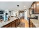 Spacious kitchen features granite counters, stainless steel appliances, and wooden floors with ample cabinet space at 5025 Kinross Ln, Indian Land, SC 29707