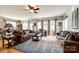 Open concept living room featuring hardwood floors, lots of natural light, and comfortable seating at 5025 Kinross Ln, Indian Land, SC 29707