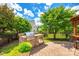 Backyard featuring a stone-clad outdoor grill, perfect for summer barbecues and entertaining at 5025 Kinross Ln, Indian Land, SC 29707