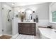 Modern bathroom with a frameless glass shower, a sleek vanity, and a soaking tub at 516 Aspen Ln, Indian Trail, NC 28079