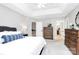 Bright primary bedroom boasts a tray ceiling, neutral walls and carpet, and a full ensuite bath at 516 Aspen Ln, Indian Trail, NC 28079