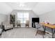 Spacious bedroom featuring a large window, an accent chair, and an office space at 516 Aspen Ln, Indian Trail, NC 28079