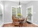 Bright kitchen dining area with natural light and an access door to the backyard at 516 Aspen Ln, Indian Trail, NC 28079