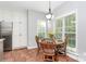 Cozy kitchen dining area featuring a round table, four chairs, and a large window at 516 Aspen Ln, Indian Trail, NC 28079