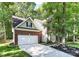 Charming home with a brick and siding exterior, attached garage, and well-manicured landscaping at 516 Aspen Ln, Indian Trail, NC 28079